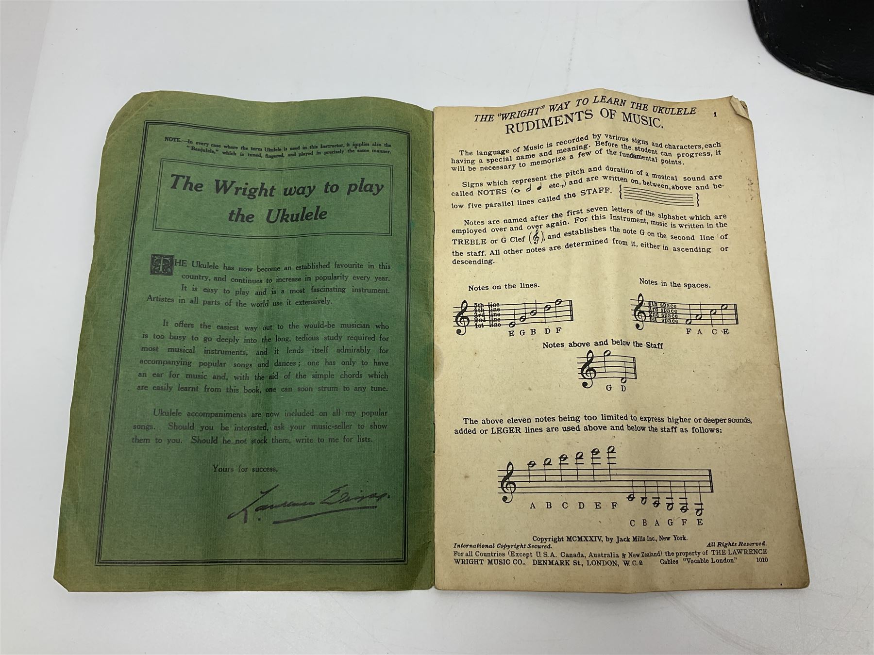 George Formby banjolele with metal plaque to headstock L55cm; in carrying case with instruction booklet.