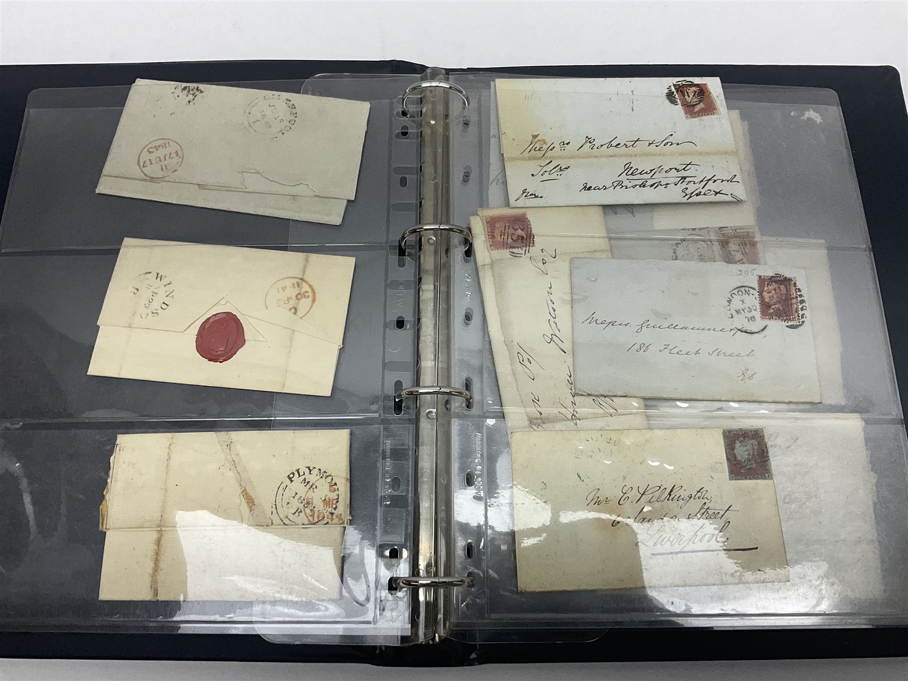 Postal history, including pre-stamp, Queen Victoria imperf penny reds on covers or entires a few with black MX cancels, 1841 two pence blue with white lines added on mourning cover, perf penny red on cover etc, housed in a ring binder folder