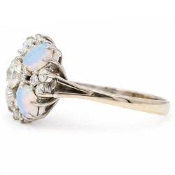 18ct white gold opal and diamond flower head cluster ring, single round brilliant cut diamond of approx 0.45 carat, surrounded by four oval cabochon cut opals and twelve diamonds, total diamond weight approx 0.80 carat