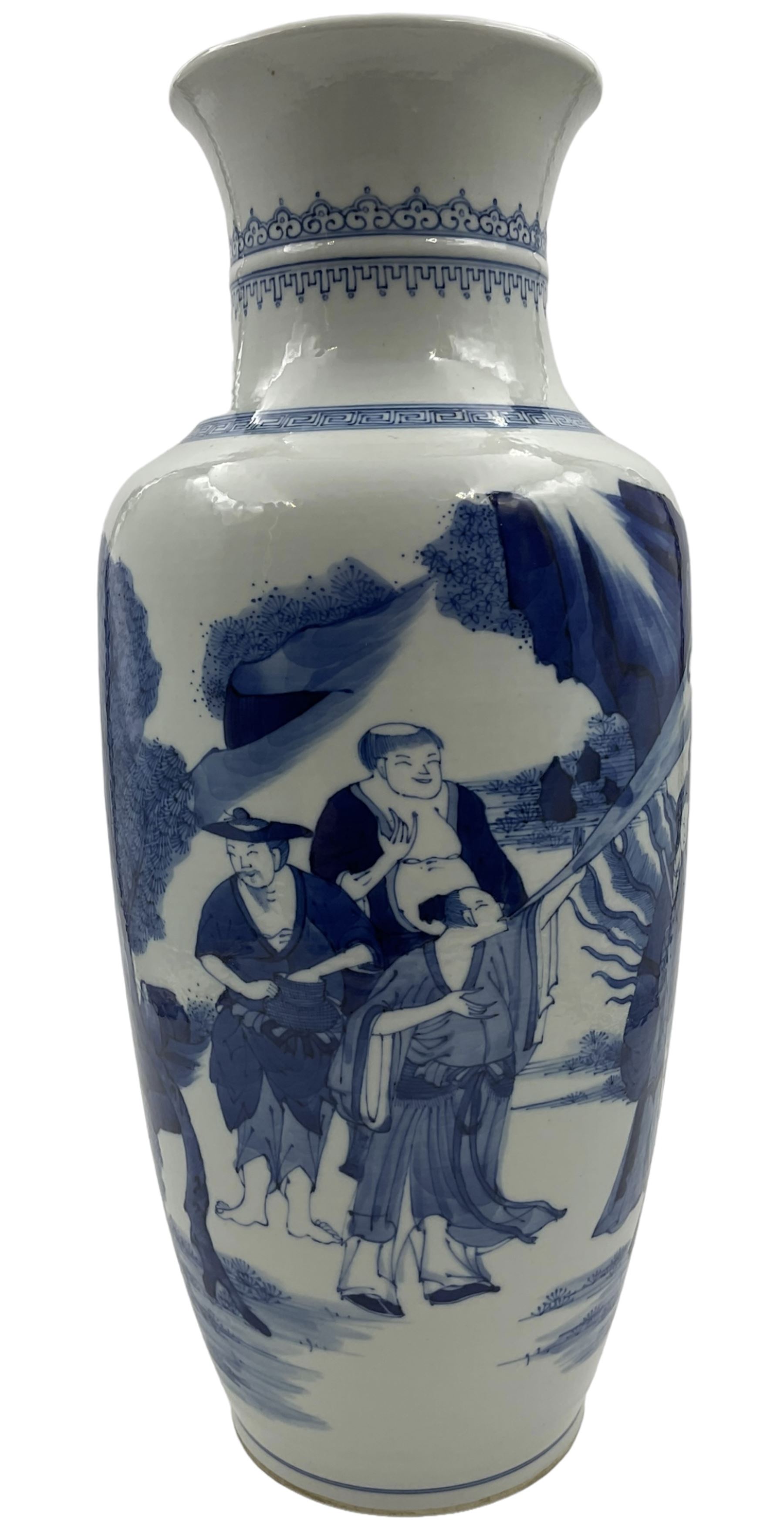 A Chinese blue and white Qing dynasty style vase, painted in underglaze blue with figures in a rocky landscape, six character Kangxi type mark to base, H34cm