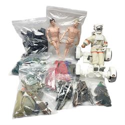 Action Man - large collection of 1960s and later figures and accessories including Spaceman with ATLRV vehicle; two figures marked 'Made in England by Palitoy under licence from Hasbro 1964'; twenty-five assorted weapons; radio backpacks; kit bags; twenty-one pairs of boots; football boots and snow shoes; metal diver's boots and three pairs of flippers; two pairs of jackboots; roller skates; various tunics, trousers, flying suits, jumpers, belts etc; twenty helmets, berets, busby, kepis, submariner etc; and quantity of other accessories