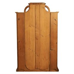 Art Nouveau oak hall mirror, the scrolling frame with large central bevelled mirror plate, boardered by six small mirrors with four shelves between, the base, with carved and pierced floral decoration, upon six cabriole legs   