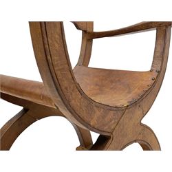 'Gnomeman' oak curved x-framed throne chair, sloped arched cresting rail carved with arcade, studded slung leather seat, the supports joined by sledge feet, rear upright carved with gnome signature, by Thomas Whittaker of Littlebeck