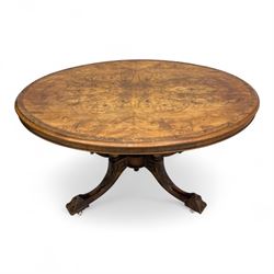 Mid-19th century Victorian burr walnut loo table, oval tilt-top with quarter veneered and ...
