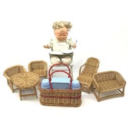 Child's picnic basket containing Bandalasta sandwich box and two Kavin Kosy flasks; Torino vinyl baby doll in blue painted wooden high chair; and doll's canework five-piece conservatory suite