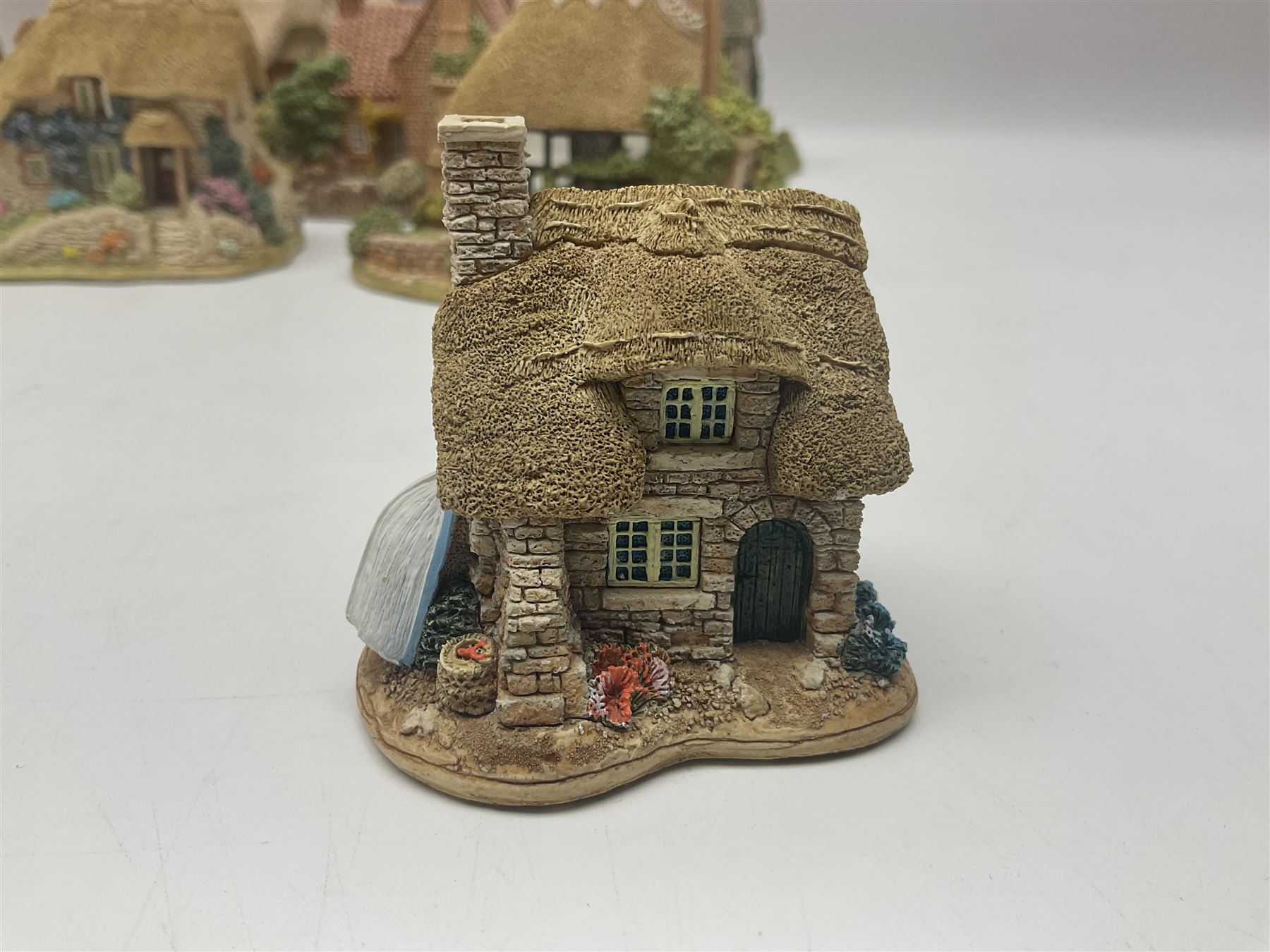 Ten Lilliput Lanes, comprising from Midlands Region Witham Delph, Jun and Disorderly, From South West Region Puffin Row, Moonlight Cove, The Cuddy, and from South West Region, The Rustlings, Saxton Cottage (1988), Marigold Meadow, Calendar Cottage and Little Lupins, all with boxes and deeds 