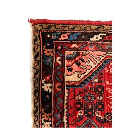 Persian crimson ground runner, the field decorated with Herati motifs,  three-band border, the main band decorated with repeating flowerheads 