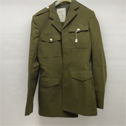 Two post-WWII British Army No.2 Dress tunics, one with Green Howards buttons; army shirt dated 1951; Royal Fleet Auxilliary jacket with trousers; three RAF/WAAF uniforms and RAF Greatcoat; and three canvas/webbing bags, two dated 1943 & 1945