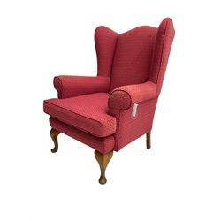 Queen Anne design wingback armchair, upholstered in lozenge patterned crimson fabric, raised on cabriole front supports