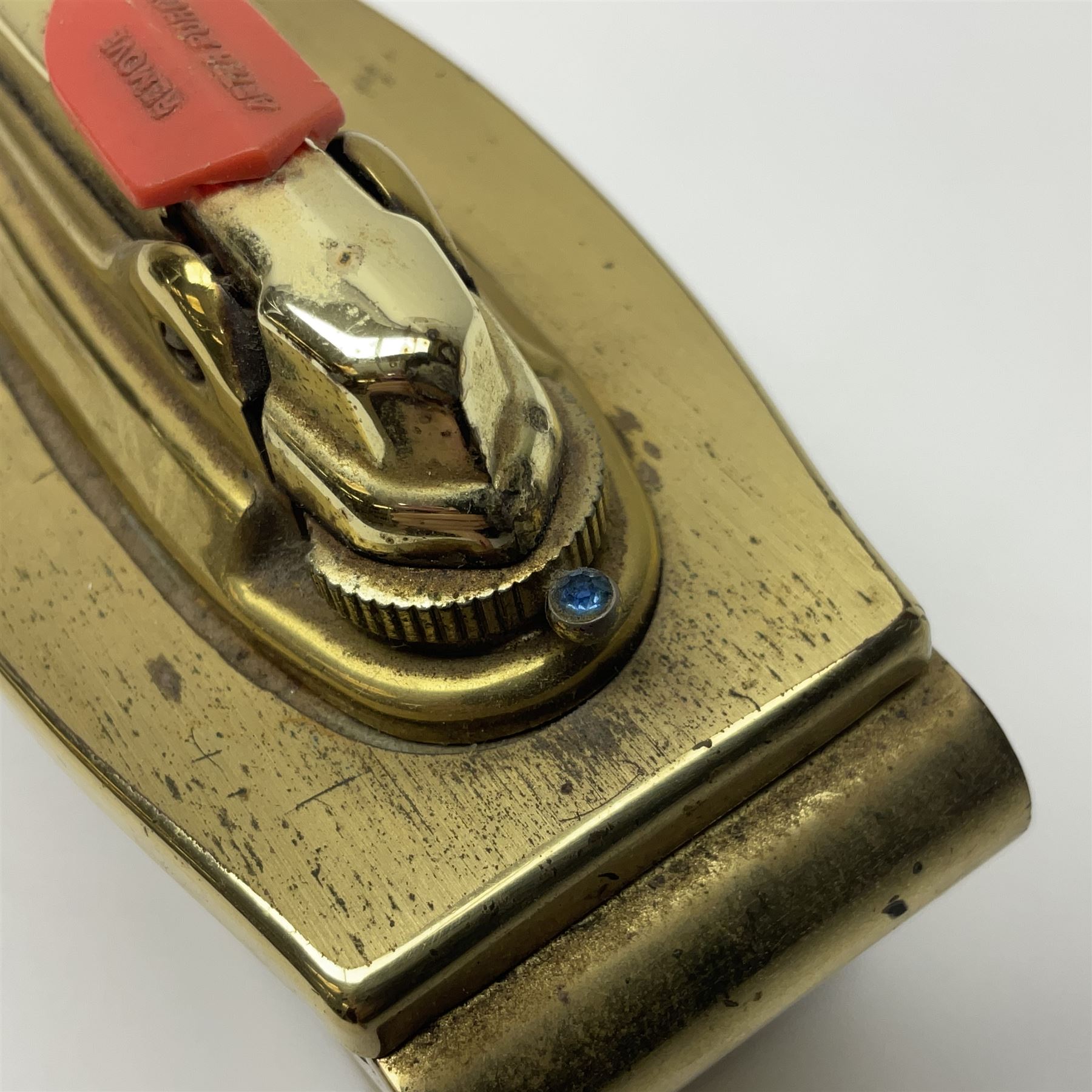 Ronson gilt metal table lighter, together with a silver-plate table lighter in the form of a football boot