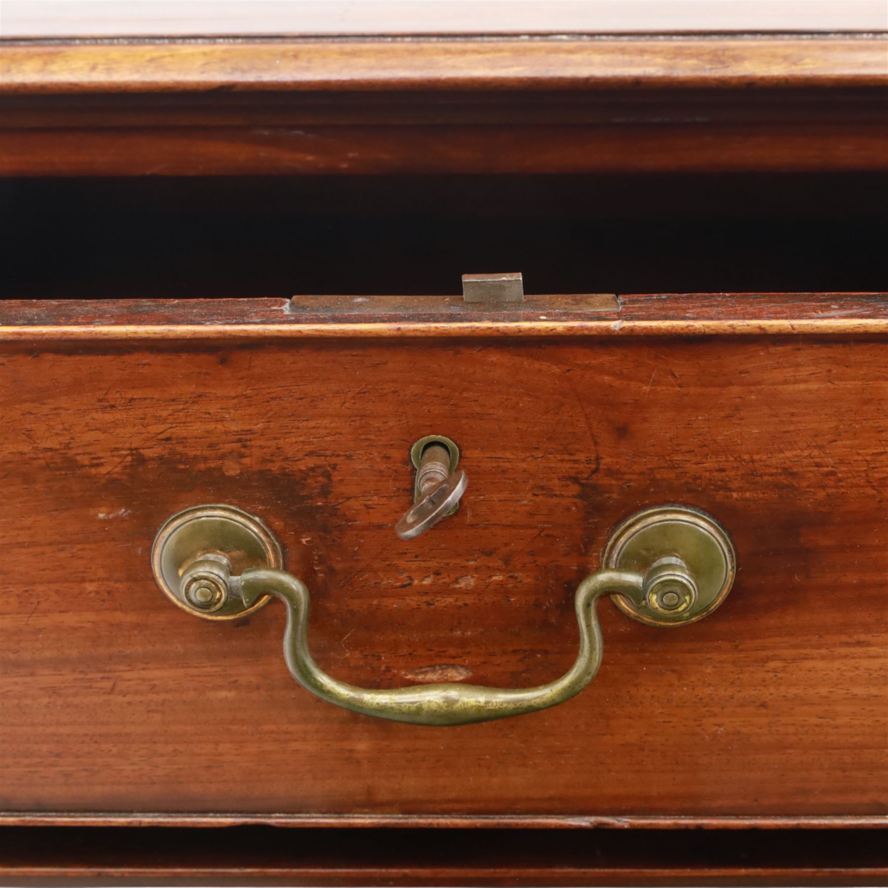 Late 19th-century Georgian-style mahogany chest of drawers, rectangular top with moulded edge over two short and three graduated drawers, raised on bracket feet, back foot missing 
