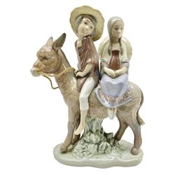 Lladro figure, A Ride in the Country, modelled as a young boy and girl riding upon a donkey, sculpted by José Puche, no 5354, year issued 1986, year retired 1994, H20cm