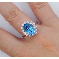 18ct white gold oval cut Swiss blue topaz and round brilliant cut diamond cluster ring, hallmarked