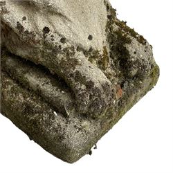 Weathered cast stone recumbent lion, on stepped rectangular base 
