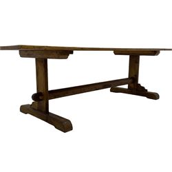 Rustic pine refectory table, rectangular boarded top on rectangular end supports united by pegged stretcher, on sledge feet
