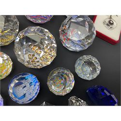Swarovski Crystal paperweights, to include a globe with dove to the top, pyramid shapes etc, together with a large collection of boxes and stands  