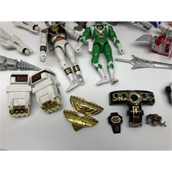 Collection of early 90s Mighty Morphin’ Power Rangers Zords, figures and accessories. Titanus the Carrier Zord, marked Bandai 1991; Green Dragonzord, incomplete; 1994 White Tigerzord with original instruction manual; 1993 Triceratops Dinozord, Mastodon Dinozord and Sabertooth Tiger Dinozord, Pterodactyl Dinozord, missing guns; with 1993 Power Morpher and original Power Coins, with further related figures, accessories and weapons