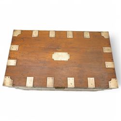 Early 19th century teak and brass bound silver campaign chest, fitted with brass L-shaped brackets and heavy weight carrying handles, the hinged lid enclosing two removeable trays with divisions and lined in blue baize, fitted with two 'R. Cooper & Son' brass locks