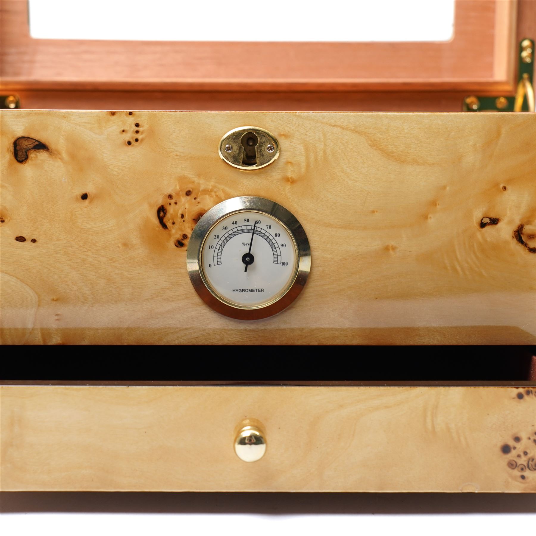 Modern burr wood  humidor, the hinged lid inset with a glass panel, recessed side handles and single drawer 35cm x 25cm x 18cm