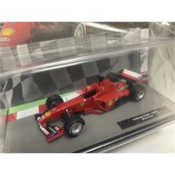 Panini Formula 1 The Car Collection - twelve die-cast models including ten in unopened packaging with periodical; all models in plastic display boxes; and eight other boxed die-cast models of racing cars by Corgi, Onyx, Classico, Minichamps etc (20)