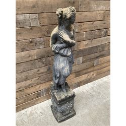 Cast stone weathered garden statue of Venus on pedestal