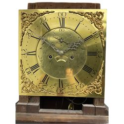 An 18th century oak cased longcase clock by M Thomas & Sons, Carnarvon c1780, flat topped hood with a wide cornice and plain frieze, glazed hood door flanked by two shaped pillars, with a long trunk and  door with a break arch top, with canted and reeded corners on a short plinth with a raised conforming break arch panel and skirting, 13” brass dial with an engraved centre,  small semi-circular date aperture and disc behind, with a subsidiary seconds dial, non-matching steel hands and scroll spandrels, Engraved chapter ring with roman numerals, five minute Arabic's and minute markers, dial pinned directly to an eight day rack striking movement, striking the hours on a cast bell. With weights, pendulum and key.    
Michael and Morris Thomas are recorded as working together in Carnarvon 1769-94.




