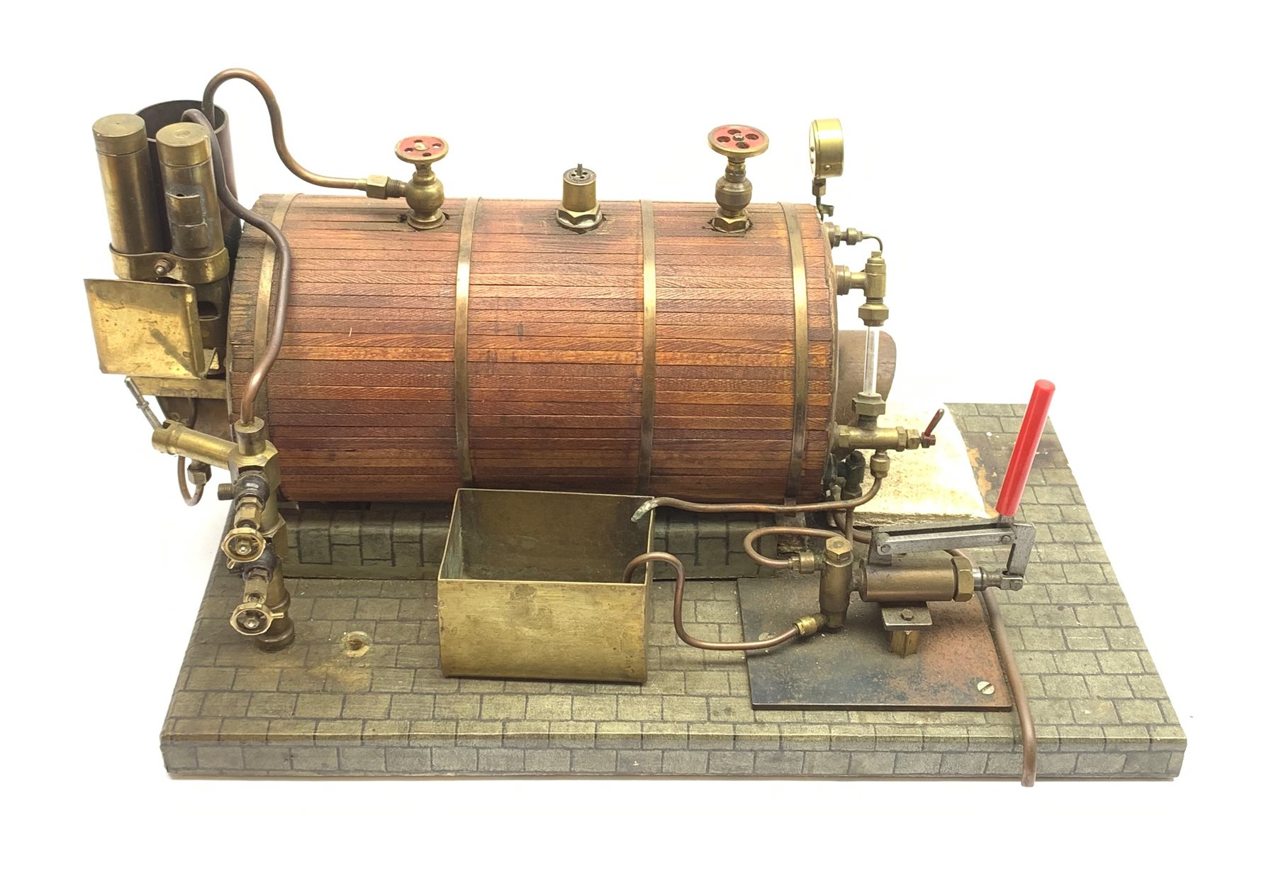 Scale built live steam model of a steam engine, planked clad and coopered copper boiler with brass pipework, manometer and water level gauge, on simulated brick wooden base L49cm H22cm