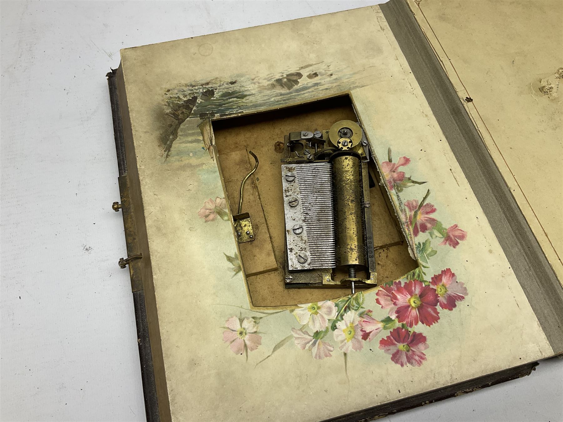 Victorian leather bound musical photo album, together with another victorian photo album, with photographs 