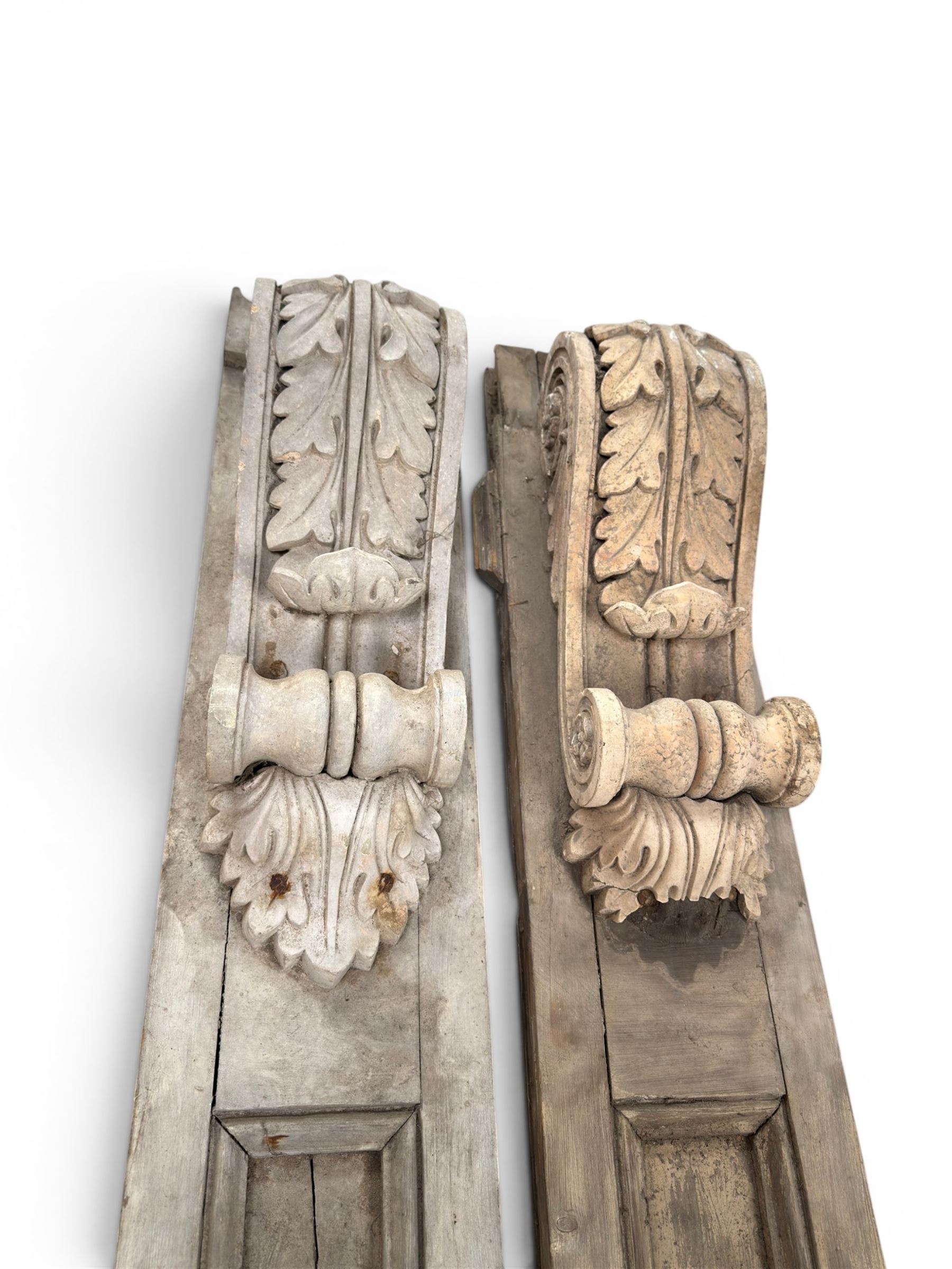 Pair of 19th century pine architectural pilasters, with painted terracotta capitols, with acanthus and scroll detail (18cm x 15cm x 57cm)