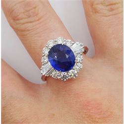 18ct white gold oval sapphire, tapered baguette cut and round brilliant cut diamond cluster ring, stamped 750, sapphire approx 2.80 carat, total diamond weight 1.00 carat