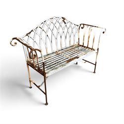 Small wrought metal two seat garden bench, finished in distressed white paint