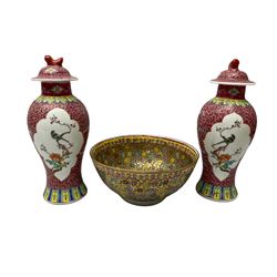Pair of  oriental famille rose vases of a baluster form with foo dog decoration on covers, together with oriental bowls with a gilt ground and floral decoration, vases H27cm 