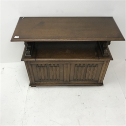 Early 20th century oak monks bench, tilt top, carved lion arms, hinged seat, plinth base, W107cm, H76cm, D45cm