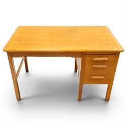 Abbess Woodwork Company - Mid  20th century solid oak single pedestal desk, rounded rectangular top with single pedestal, oak pull handles with fitted slide, above a drawer with cutlery divider, over a double height drawer, square tapering supports united by stretchers