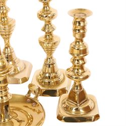 Pair of 19th century brass chamber candlesticks with detachable snuffers, together with three pairs of brass candlesticks 