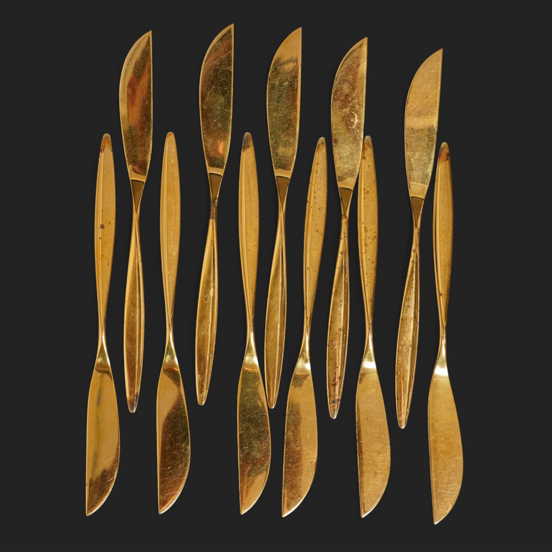 Extensive suite of WMF 800 silver gilt cutlery, for twelve covers, comprising twelve table knives and forks, fish knives and forks, dessert forks, table spoons, dessert spoons, teaspoons, eleven dessert forks and six serving spoons, with crescent moon and crown WMF hallmarks