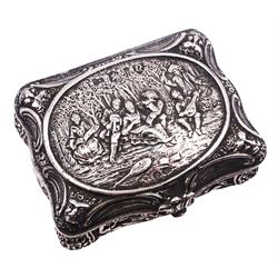 Late 19th century German Hanau silver box, of shaped rectangular form, embossed throughout, the hinged cover decorated with a central oval panel depicting a genre scene with musicians, the corners detailed with masks, the sides detailed with conforming figures and musical trophies, opening to reveal a gilt interior, with Hanau marks for Neresheimer & Sohne, and hallmarked B Muller & Son, London import 1907, approximate weight 3.32 ozt (103.4 grams)