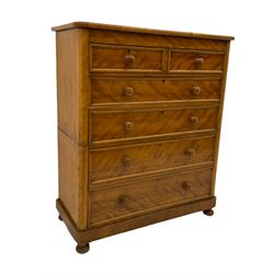 Victorian satinwood chest, fitted with two short and four long drawers, rounded corners, bun feet
