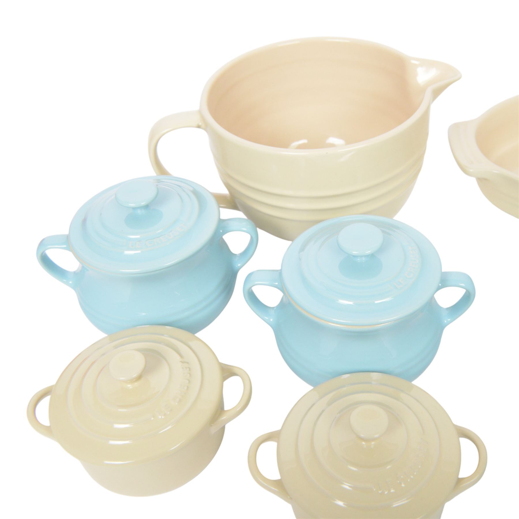 Le Creuset ceramic kitchen wares in cream and light blue, including pie dishes, baking dishes, petit casseroles etc  