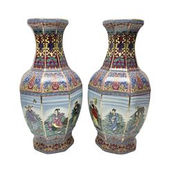 Pair of 20th century Chinese vases, of octagonal baluster form, each central panel decorated with one of The Eight Immortals, bordered by panels of floral motifs upon a pink/purple ground, H33.5cm