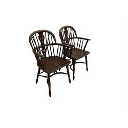 Pair late 20th century oak Windsor elbow chairs, double hoop and stick back with pierced and fretwork work splat, dished seat on turned supports joined by crinoline stretcher