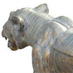 Pair of Chinese cast bronze tiger figures, one in a seated resting pose and the other advancing with open mouth, both with incised striping and aged bronze patina
Seated tiger (H 54cm, W 63cm, L 129cm)
Stood tiger (H 76cm, W 40cm, L 176cm) 