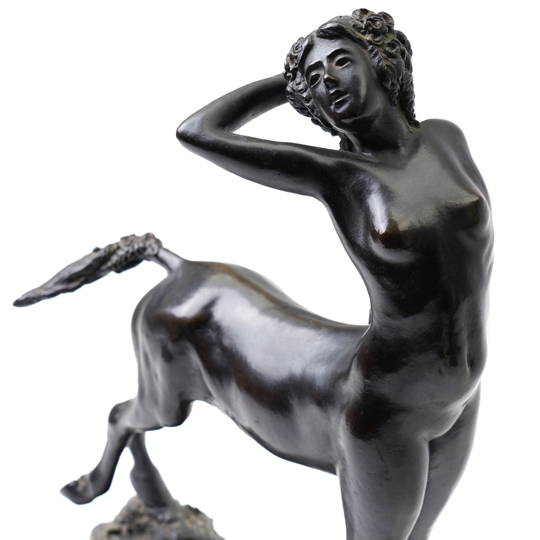 Walter Winans (St Petersburg 1852-1920): The Centauress, bronze model signed and dated 1915 to the naturalistic base, on a rectangular marble plinth, L30.5cm, H42cm

Notes: A finely modelled bronze depicting a rare female centaur, combining classical mythological subject matter with the fluid naturalism characteristic of Winans’ mature work.