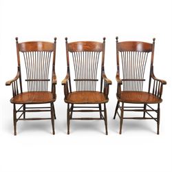 Set of three 19th century ash and elm spindle back Windsor armchairs, arched top rails abo...