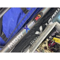 Fishing equipment, comprising reels to include Daiwa No.7300, boxed, Quick GLX 840, Quantum Heat BCS 350, okuma etc, together with various tackle, various poles, split canes and rods to include Middy Xtreme, Shakespeare Quo Carp, etc, many in bags