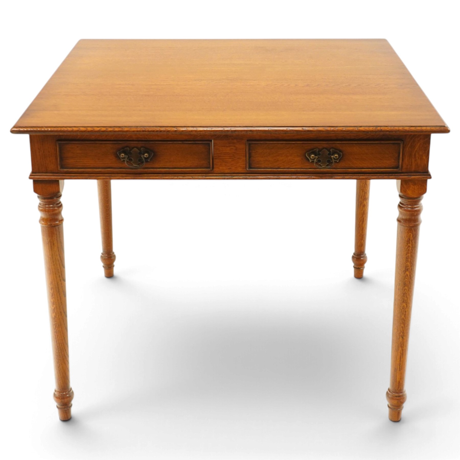 Georgian design honey-oak breakfast table of square form, the moulded edge fitted with two cock-beaded drawers, raised on turned and tapering supports