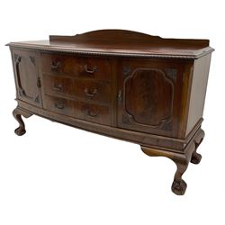 Early 20th century mahogany bow front sideboard, fitted with three drawers and two cupboards, ball and claw feet
