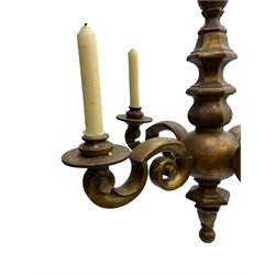 18th century giltwood chandelier, faceted and moulded extending stem with a globular centre, four extending branches of scrolled form with candle sconces, on wrought metal link chain
