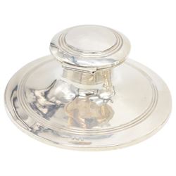 Two early 20th century silver mounted capstan inkwells, both of typical form, the first example hallmarked Wilmot Manufacturing Co, Birmingham 1918, the second example hallmarked Spooner Clowes & Co, Birmingham 1908, largest D15cm, H9.5cm