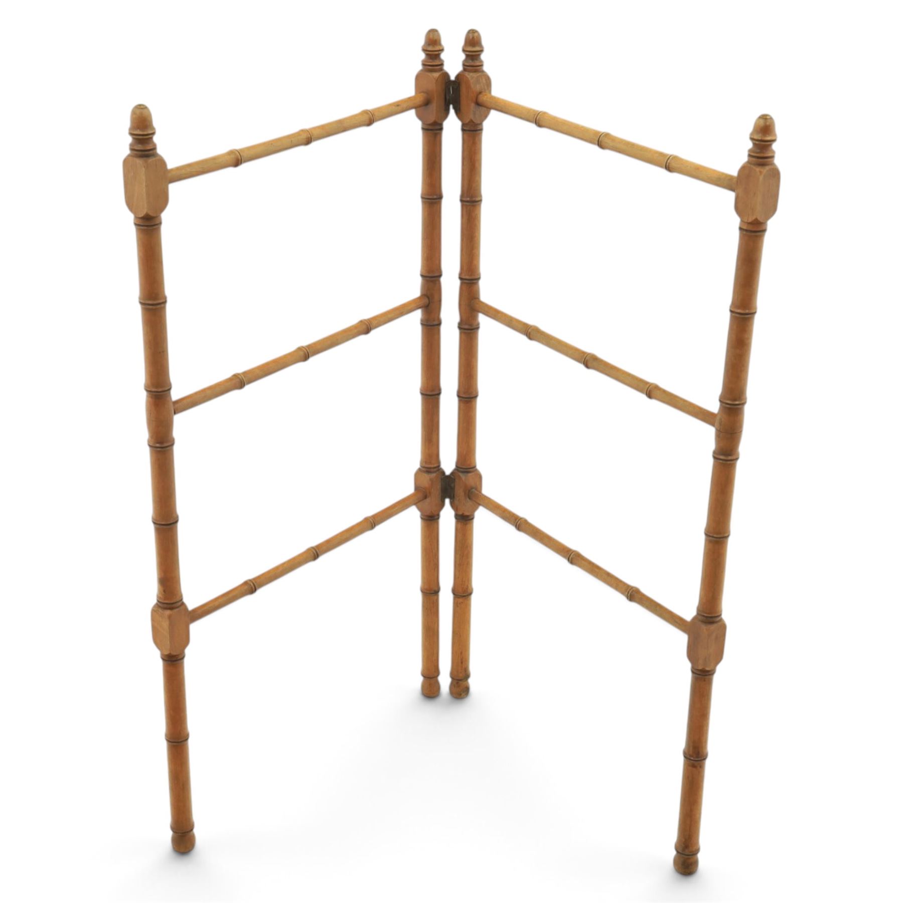 Victorian simulated bamboo two section towel rail, with turned brass capped finials, with three rails for hanging, hinged at one side